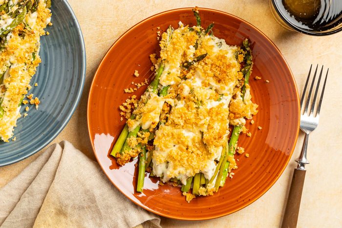 Taste of Home Asparagus Casserole photo of finished recipe served on plates.