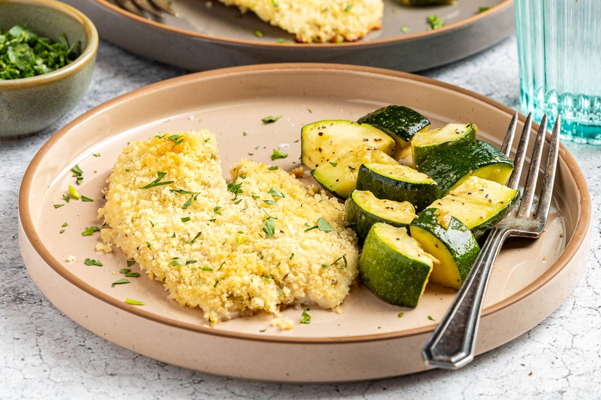 Taste of Home Baked Tilapia with Panko Bread Crumbs photo of the finished recipe served on plates.