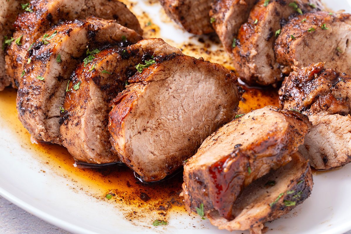 Close up of sliced Balsamic Pork Tenderloin on a serving platter for Taste of Home