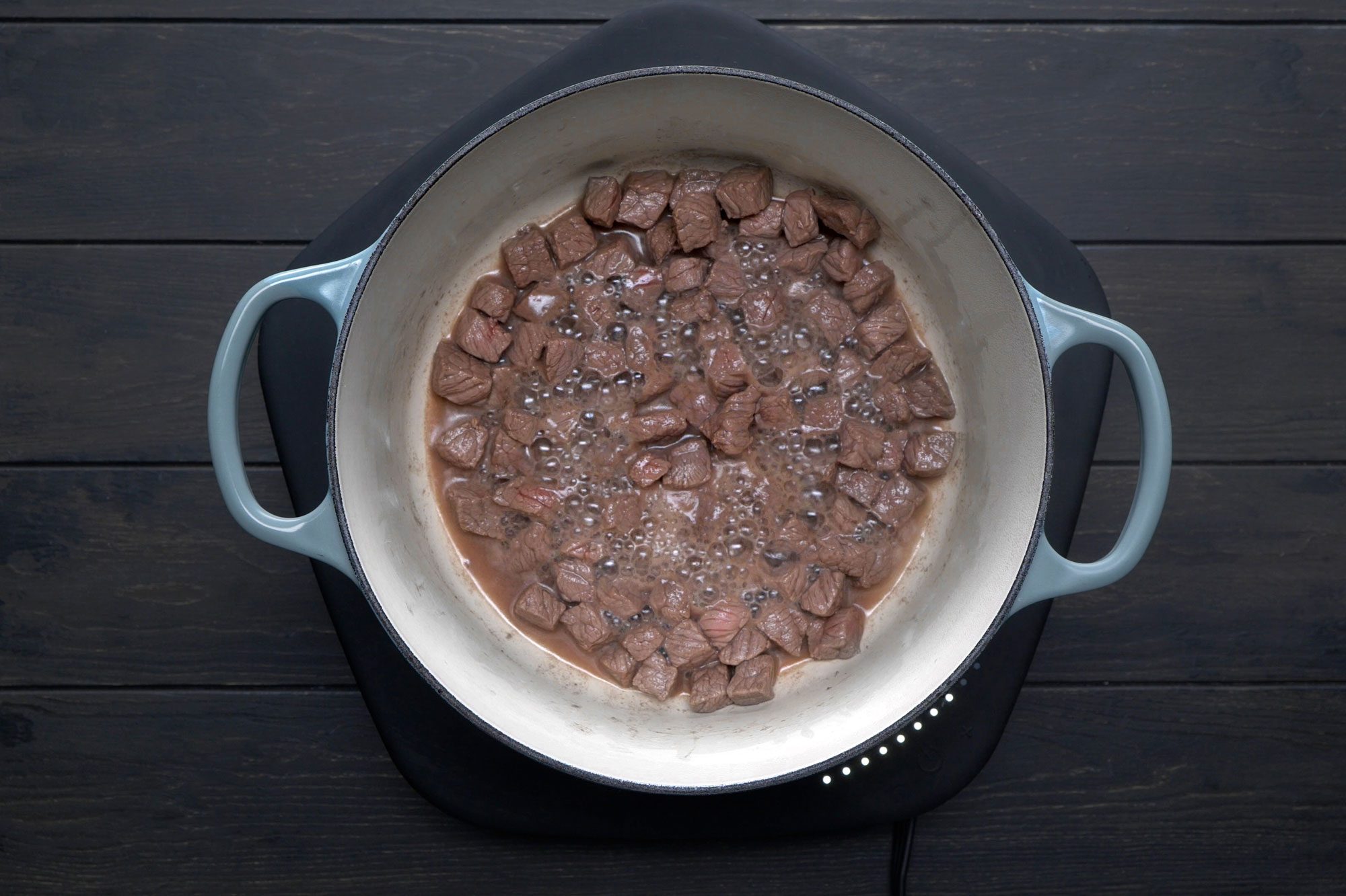 In a large saucepan, heat oil over medium heat, Brown beef on all sides