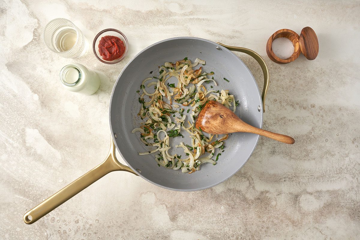 Blush Sauce recipe featuring penne pasta in a creamy tomato-based sauce with white wine, onion, thyme, and basil. Step-by-step images show the process from cooking the pasta to preparing the sauce, and combining it all. Final hero shots highlight the dish, garnished with Parmigiano-Reggiano cheese.