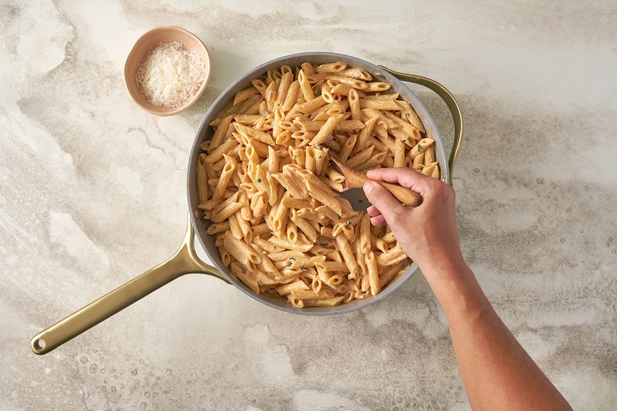 Stir the sauce into the cooked pasta, and sprinkle the remaining cheese on top before serving this Creamy Pasta recipe.