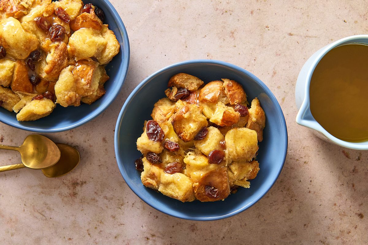 Overhead shot of Bread Pudding With Bourbon Sauce served in two bowls