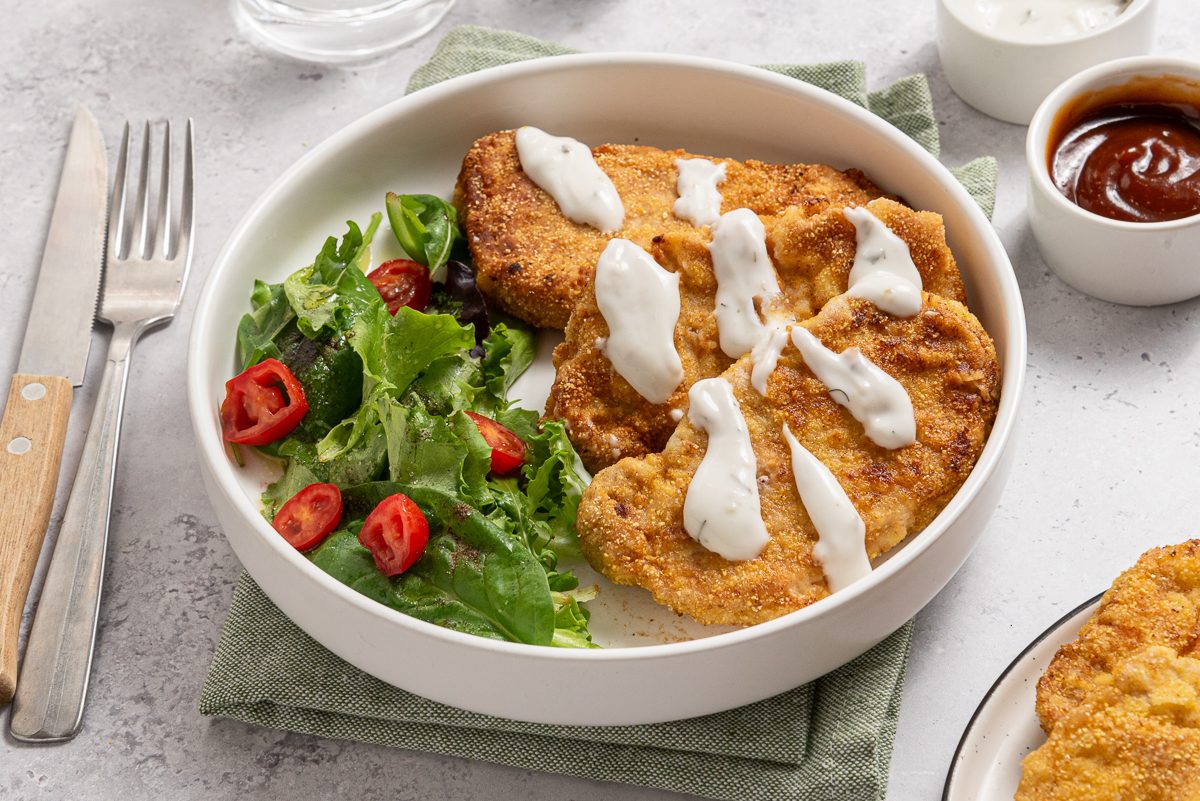 Breaded Pork Tenderloins And Green Salad With Ranch Sauce