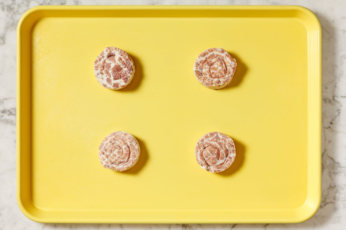 Four Rolls On A Greased Baking Sheet.