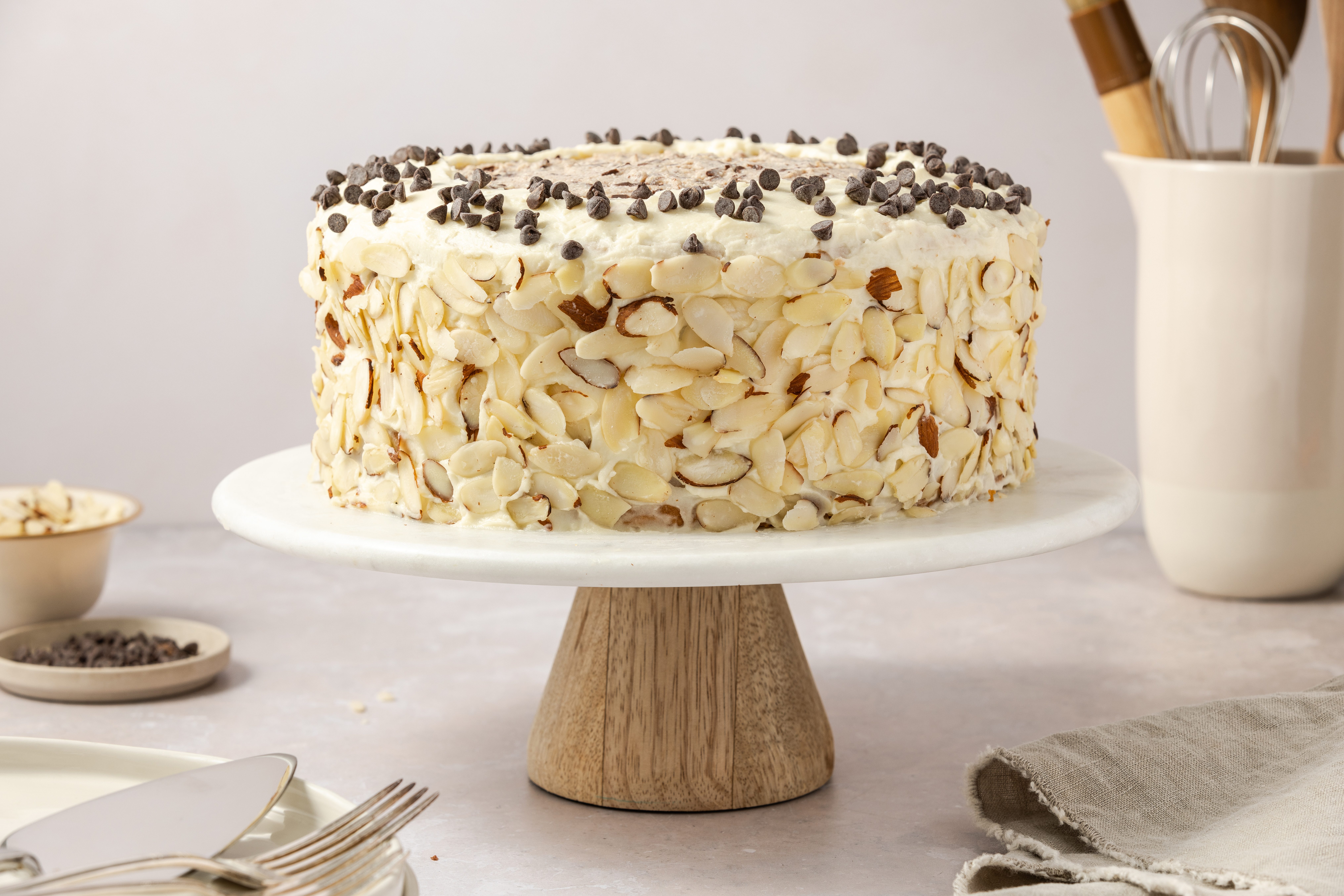 Cannoli cake ready to serve on cake stand.