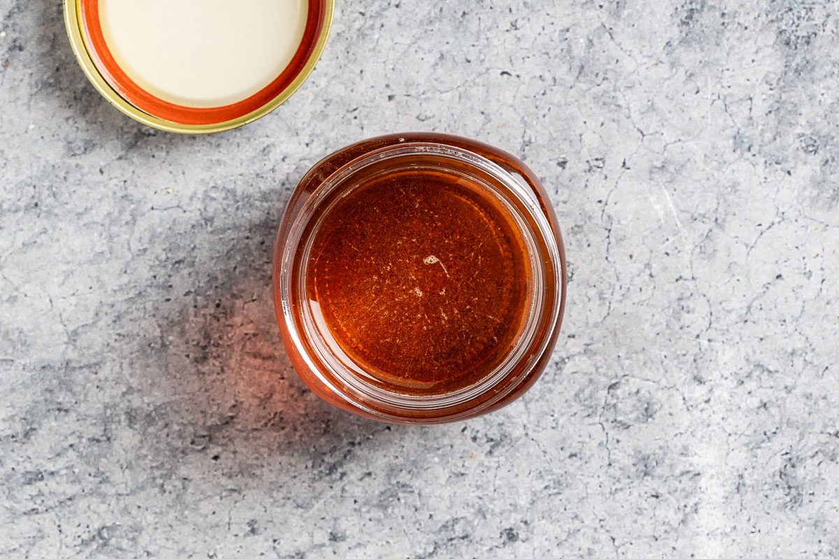 Taste of Home Caramel Syrup photo the cooled syrup transferred to a jar.