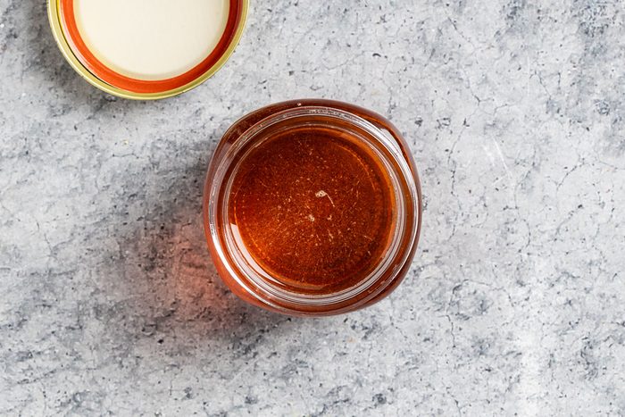 Taste of Home Caramel Syrup photo the cooled syrup transferred to a jar.