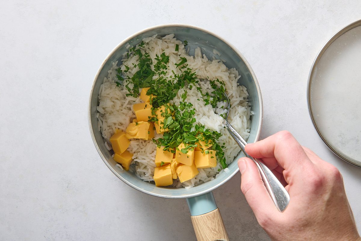 Stirring in the cheese and herbs
