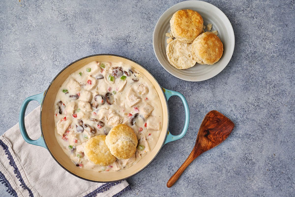 A full view of Chicken à la King, served over freshly baked biscuits with a creamy sauce and tender chicken