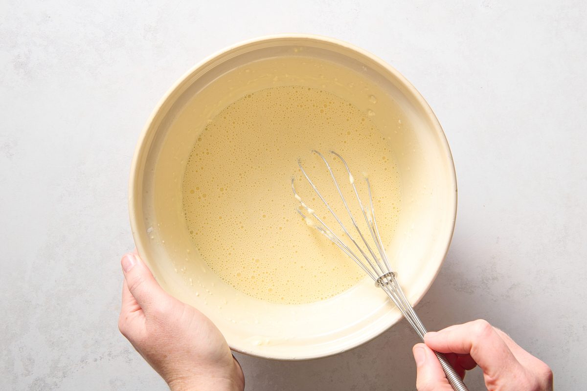 Preparing the egg mix in a bowl