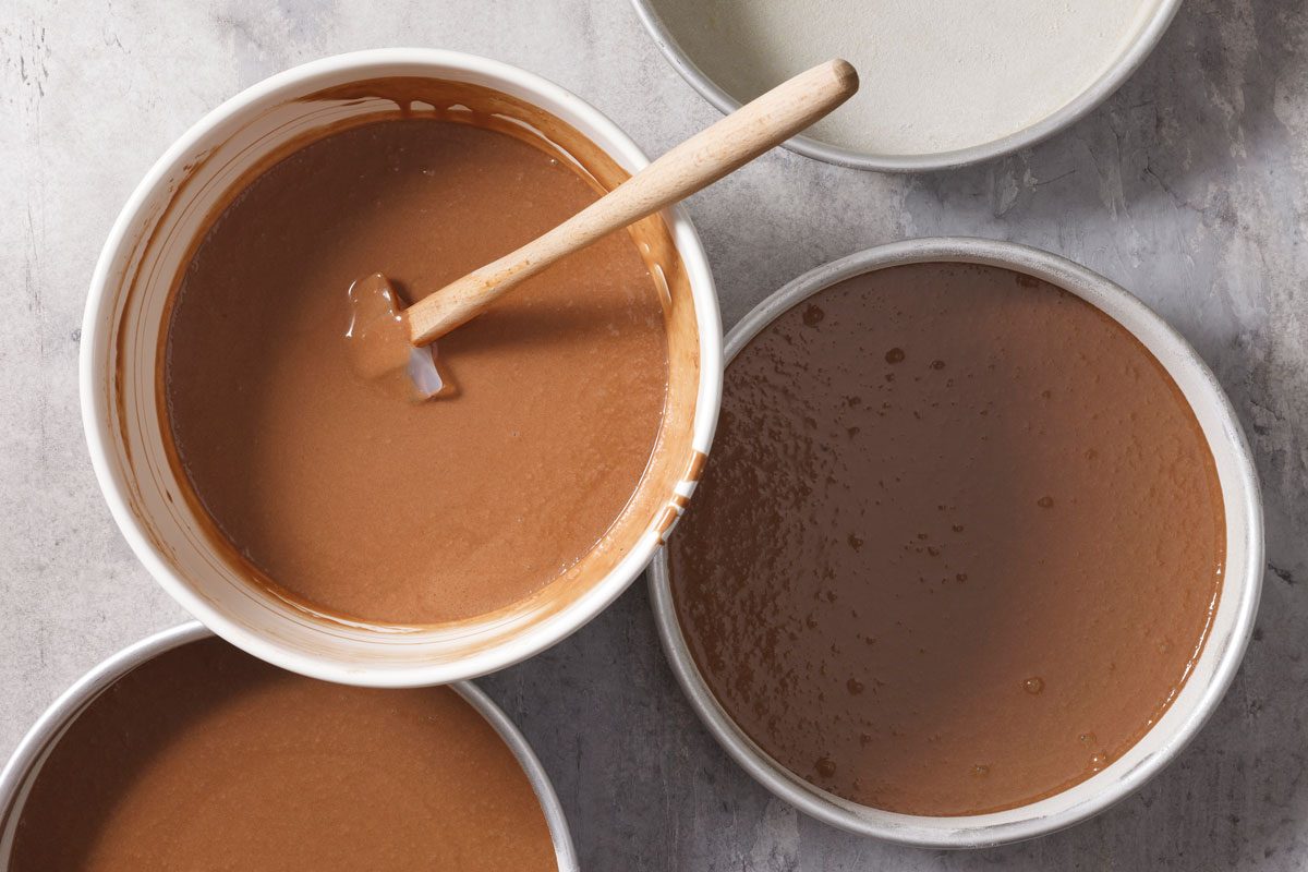 Transferring batter To The Prepared Pans