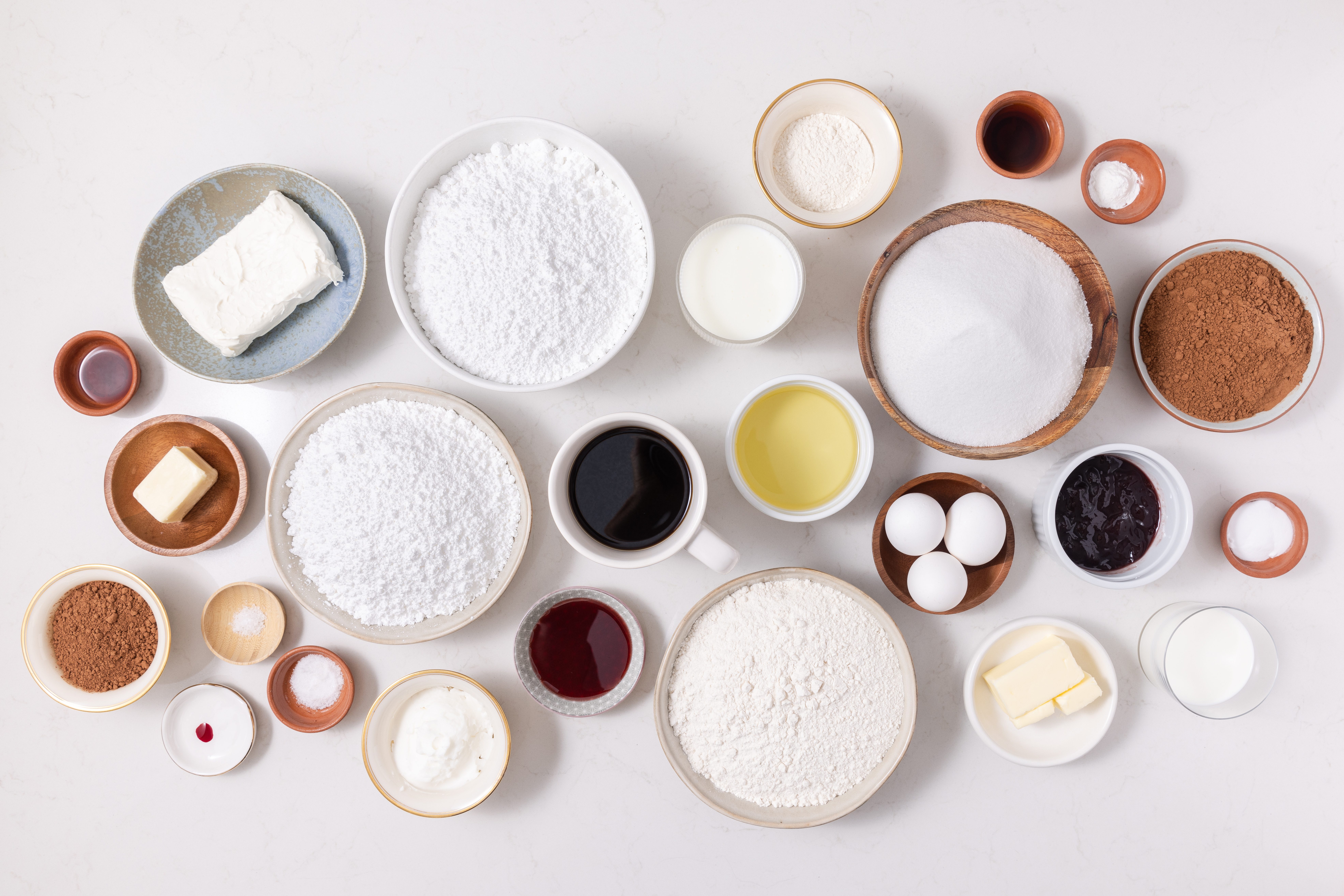 Ingredients for chocolate raspberry cake on kitchen counter.