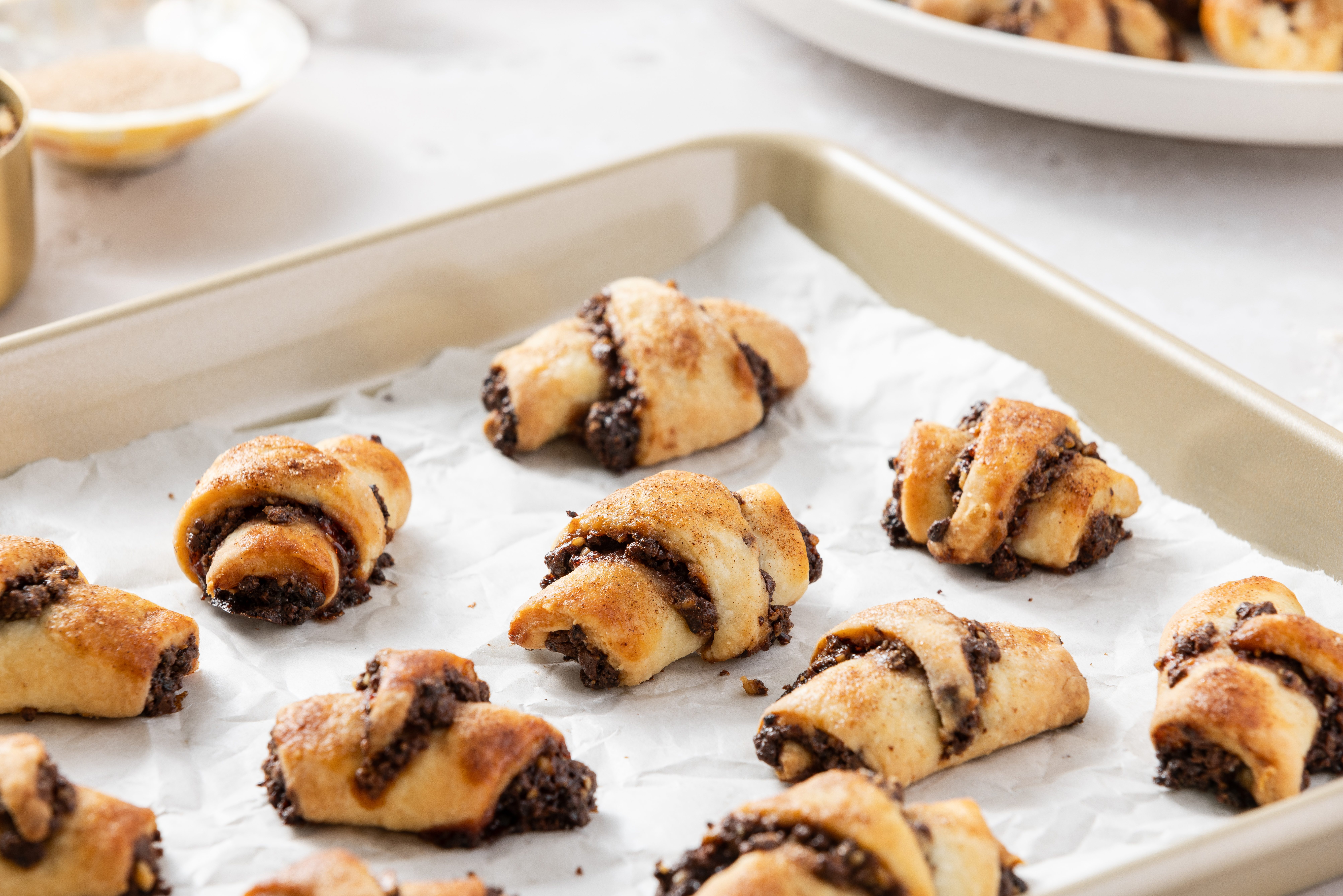 Close up of chocolate rugelach ready on baking tray.