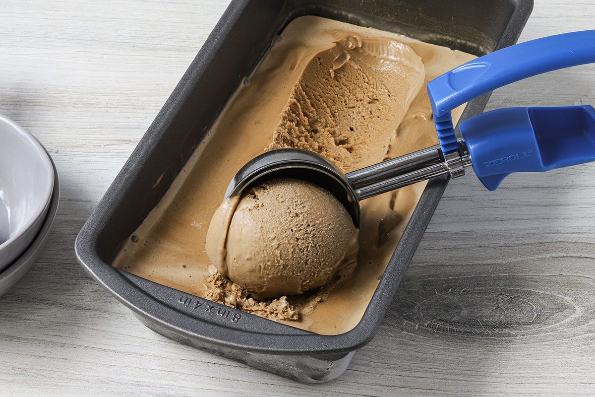 Scooping homemade coffee ice cream, a recipe from Taste of Home.