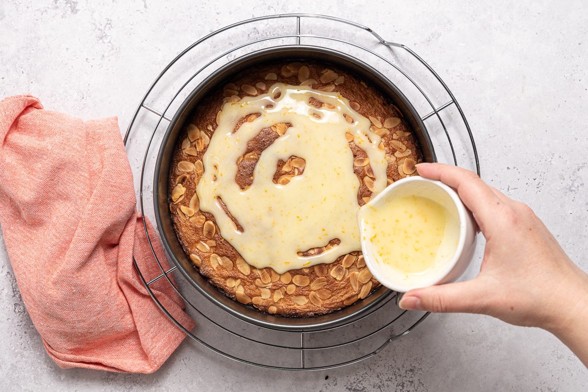 Sugar Icing Drizzled Over Cranberry Orange Cake