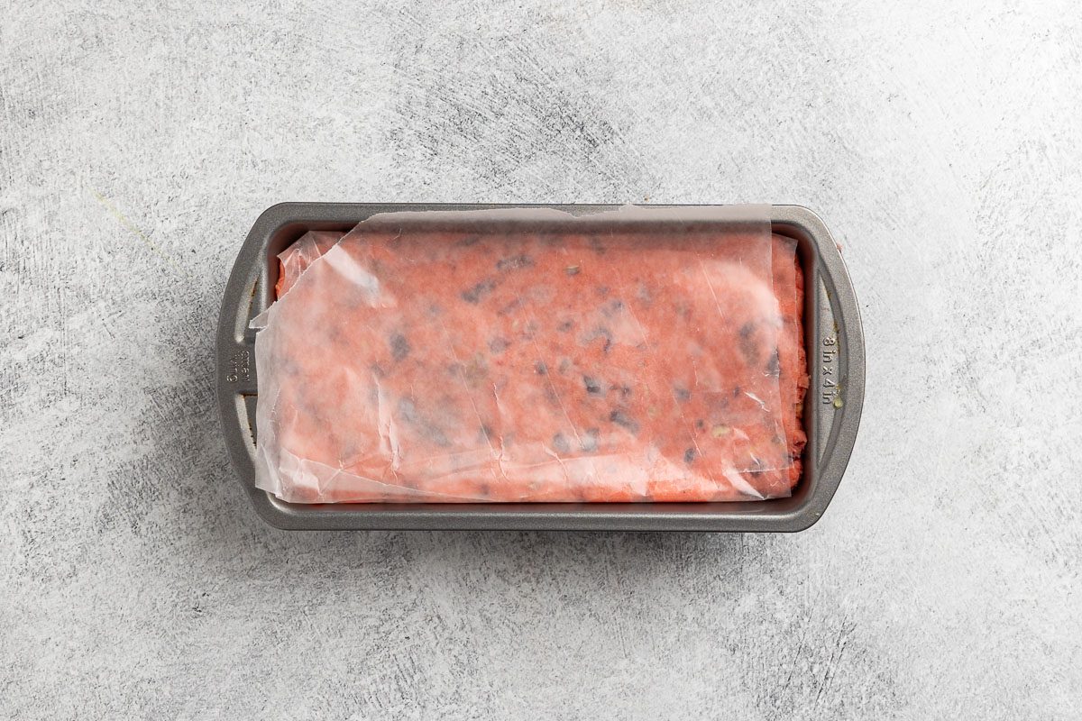  forming the dough in a loaf pan.