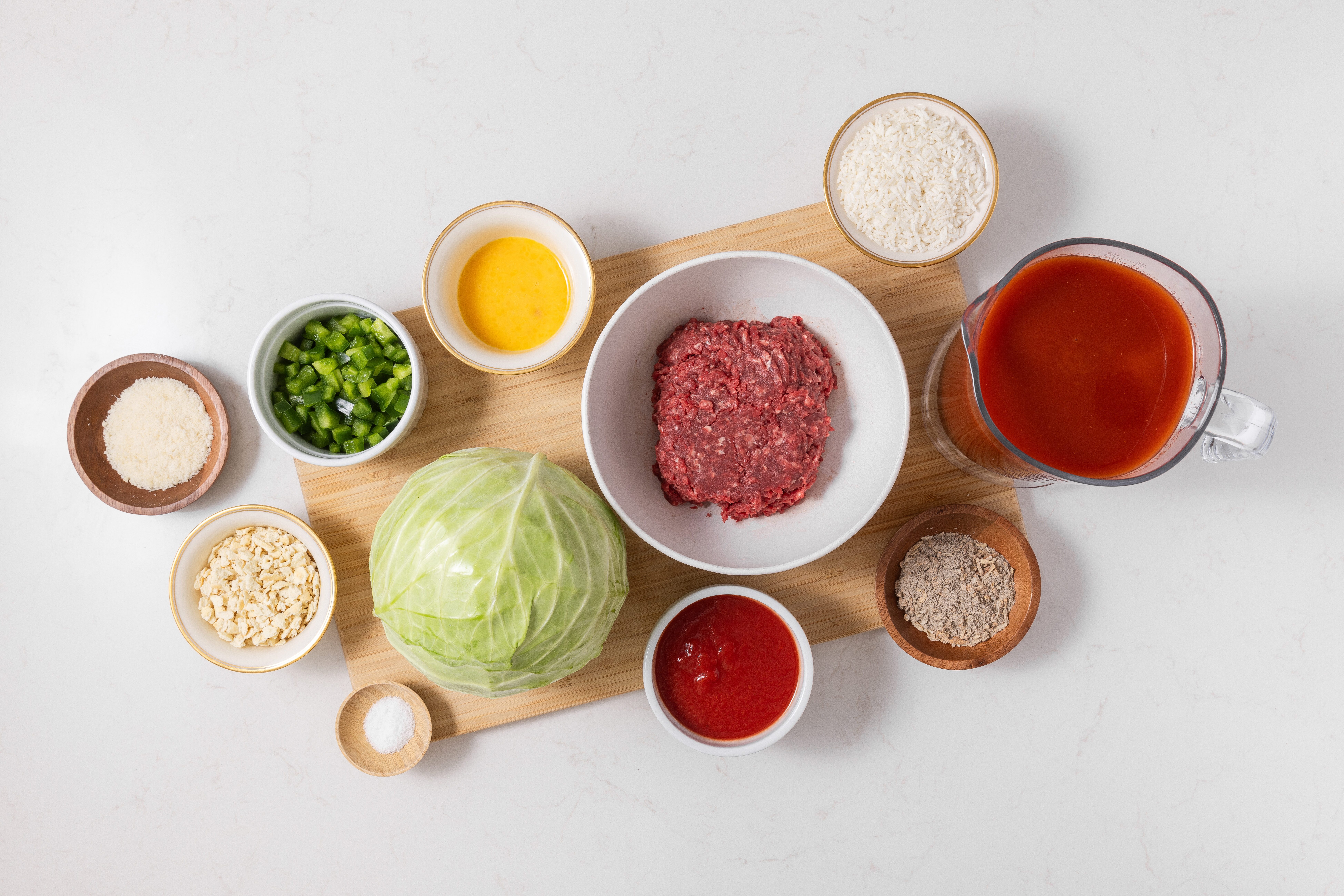 Ingredients for crockpot cabbage rolls on kitchen counter.