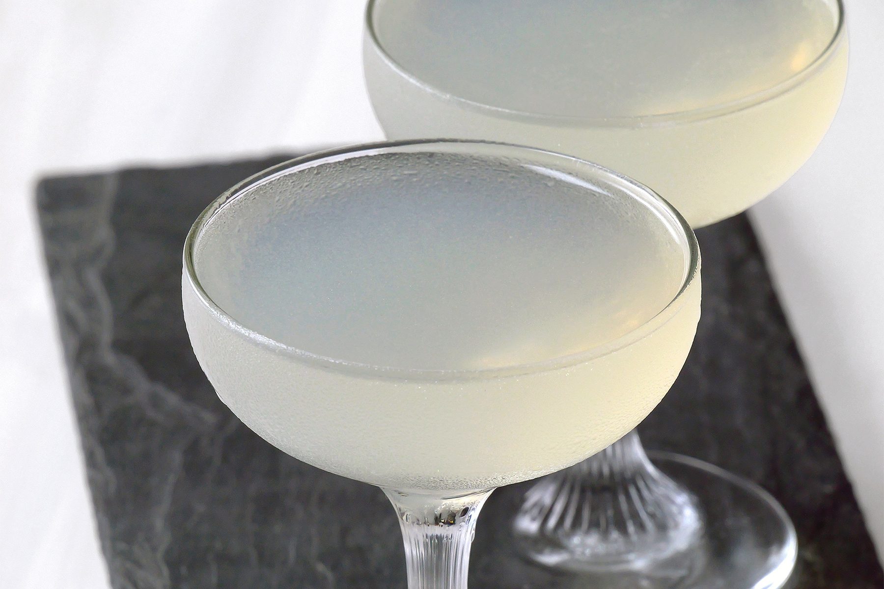 High angle view shot of Daiquiri; served on tray; white background;