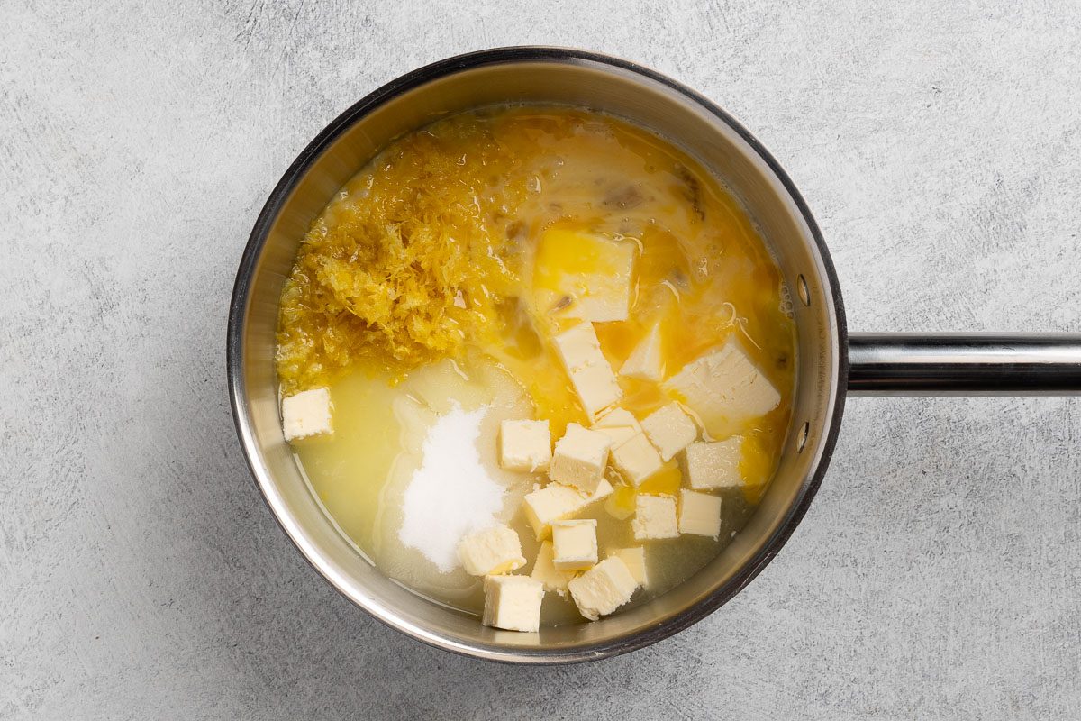 Easy Lemon Curd ingredients in a saucepan.
