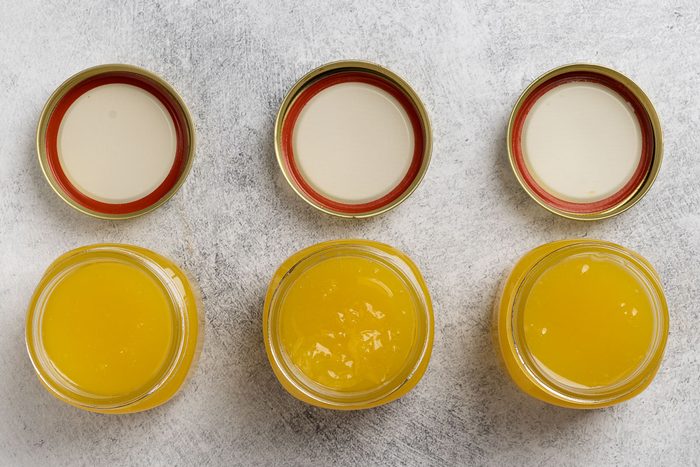 putting Easy Lemon Curd in a jars