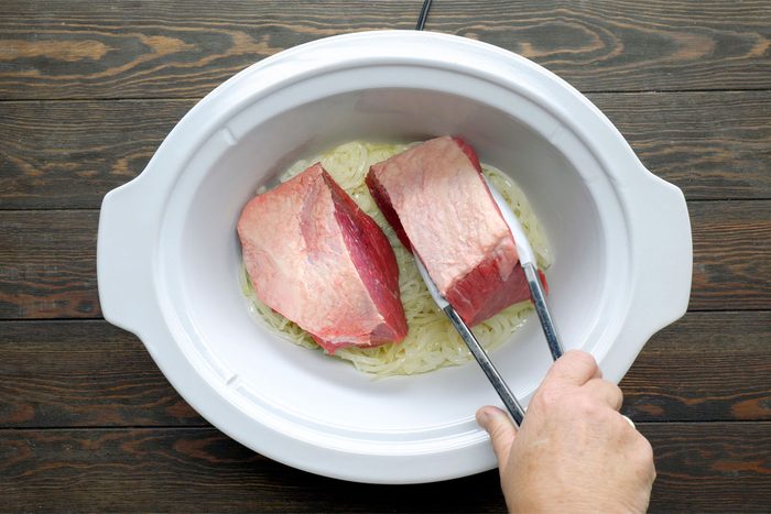 Cut Roast In Half; Place Over Onions.