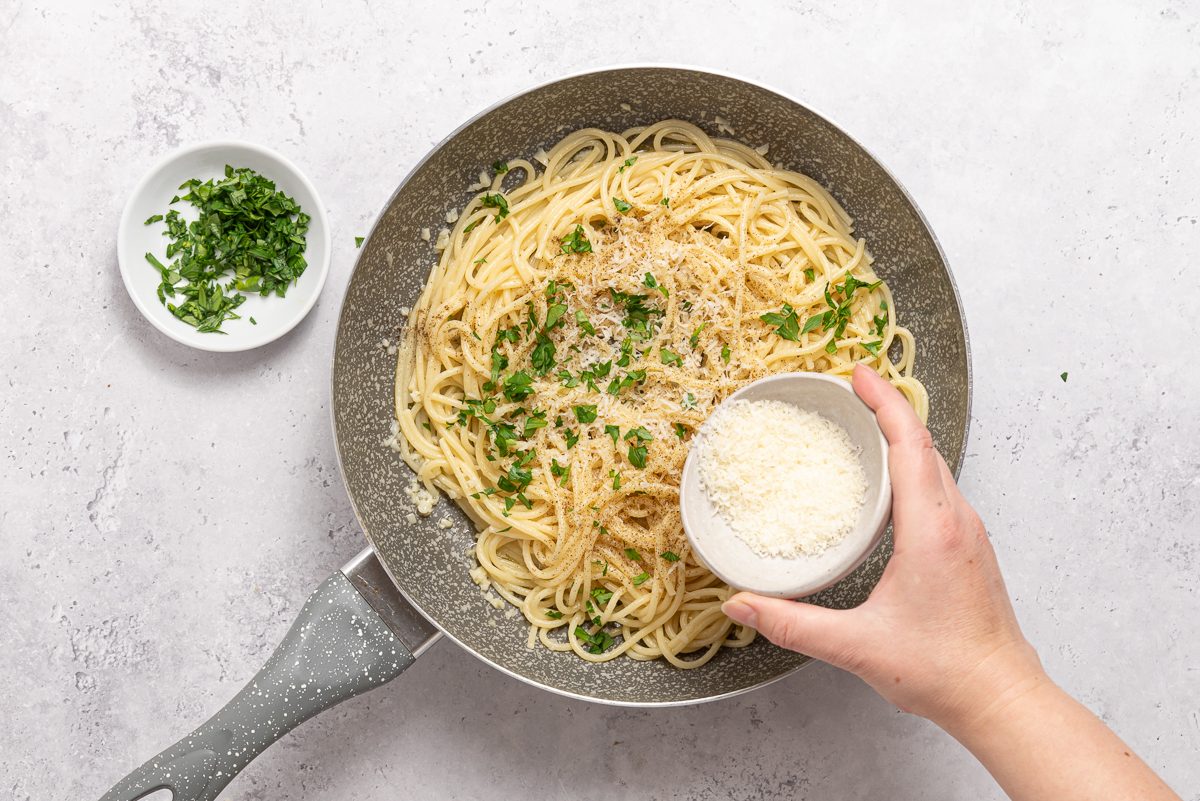 Garlic Butter Spaghetti In Pan With Parsley And Parmesan