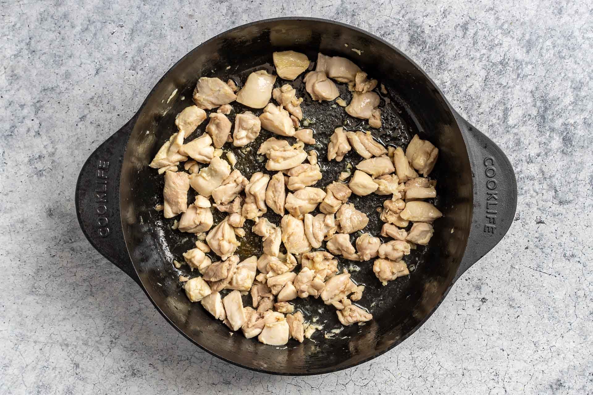 Taste of Home Green Chili Chicken Soup photo of the cooked chicken in a Dutch oven.