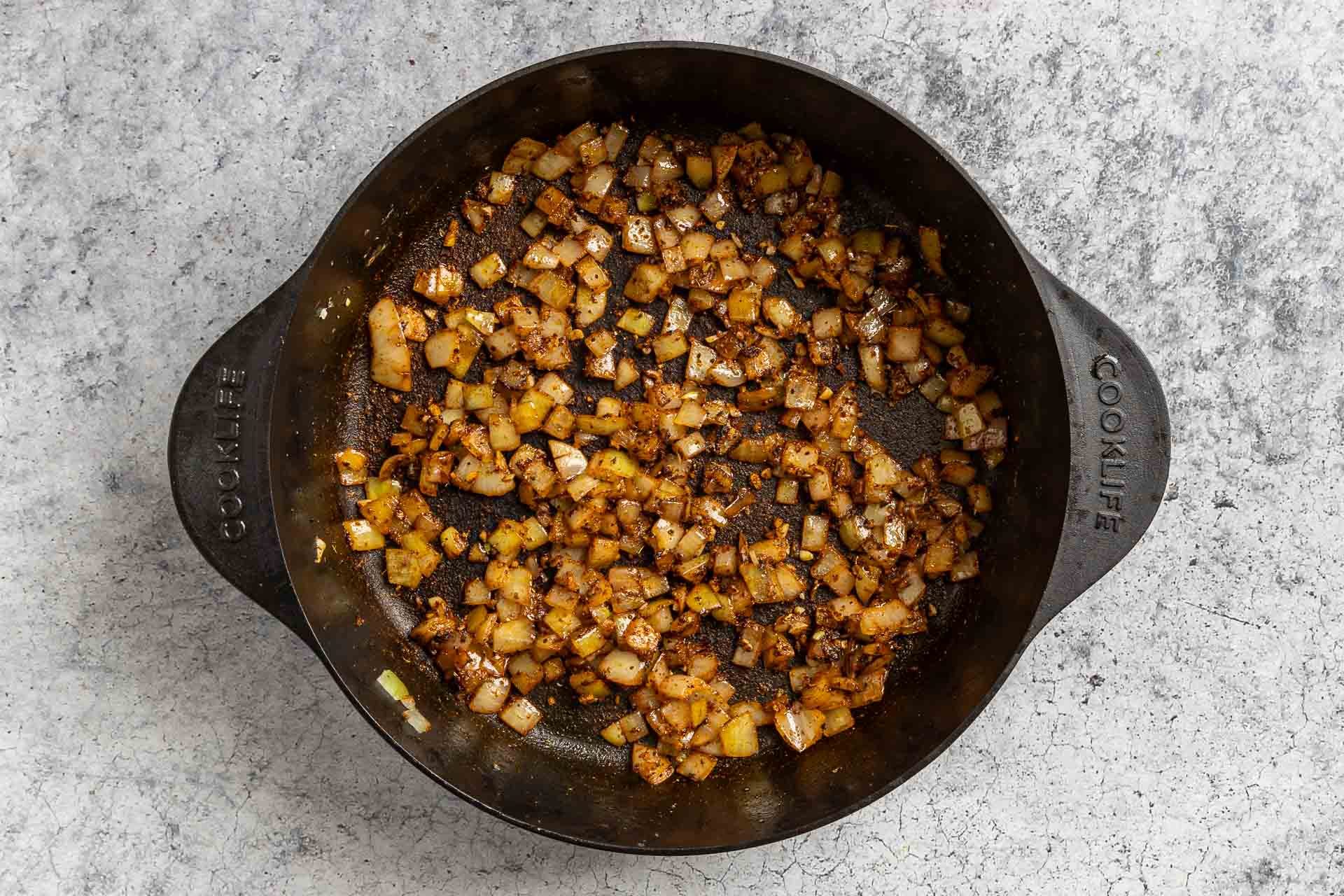 Taste of Home Green Chili Chicken Soup photo of the sauteed onion, garlic and seasonings in the Dutch oven.