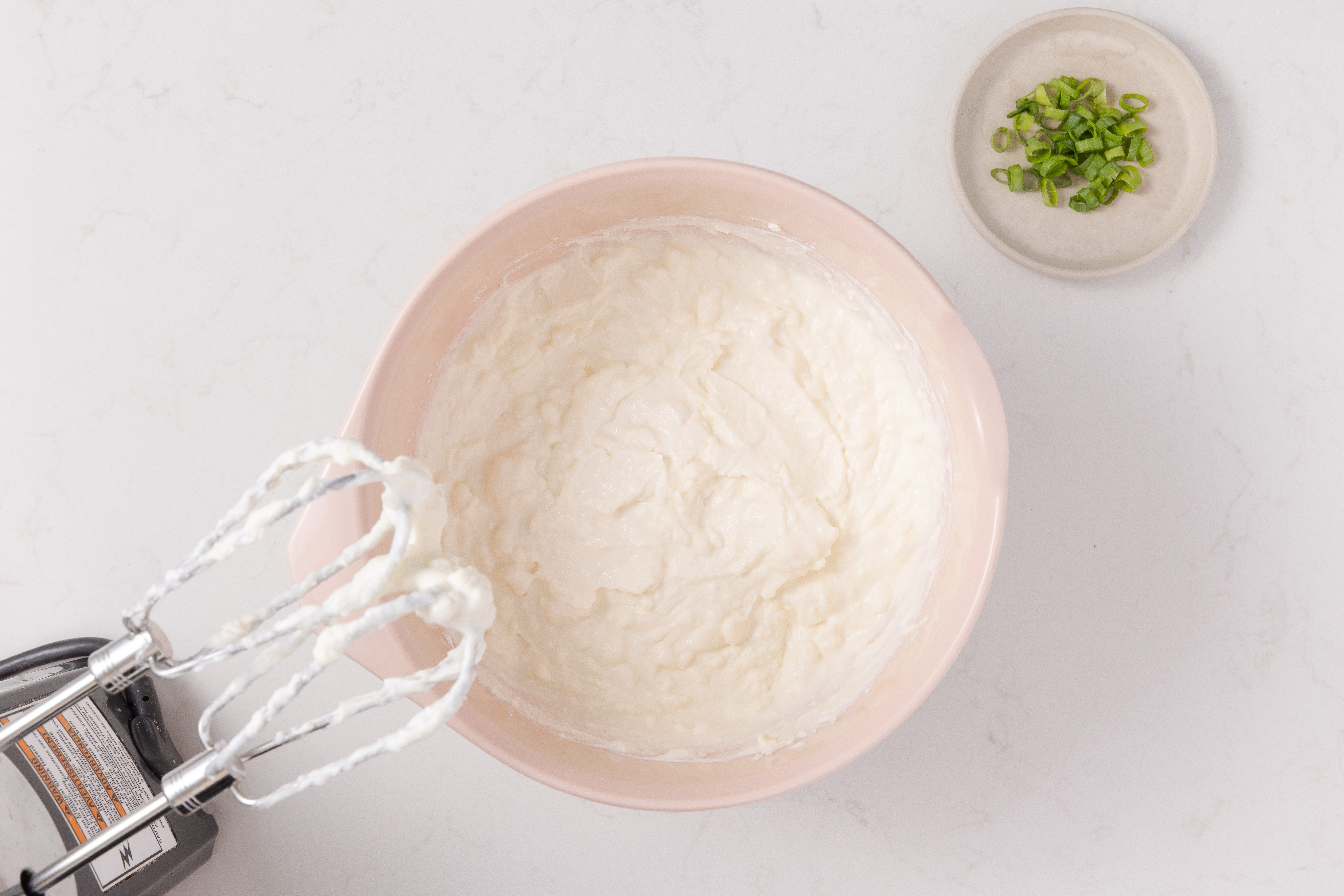 Cream cheese, ricotta and sour cream in mixing bowl.
