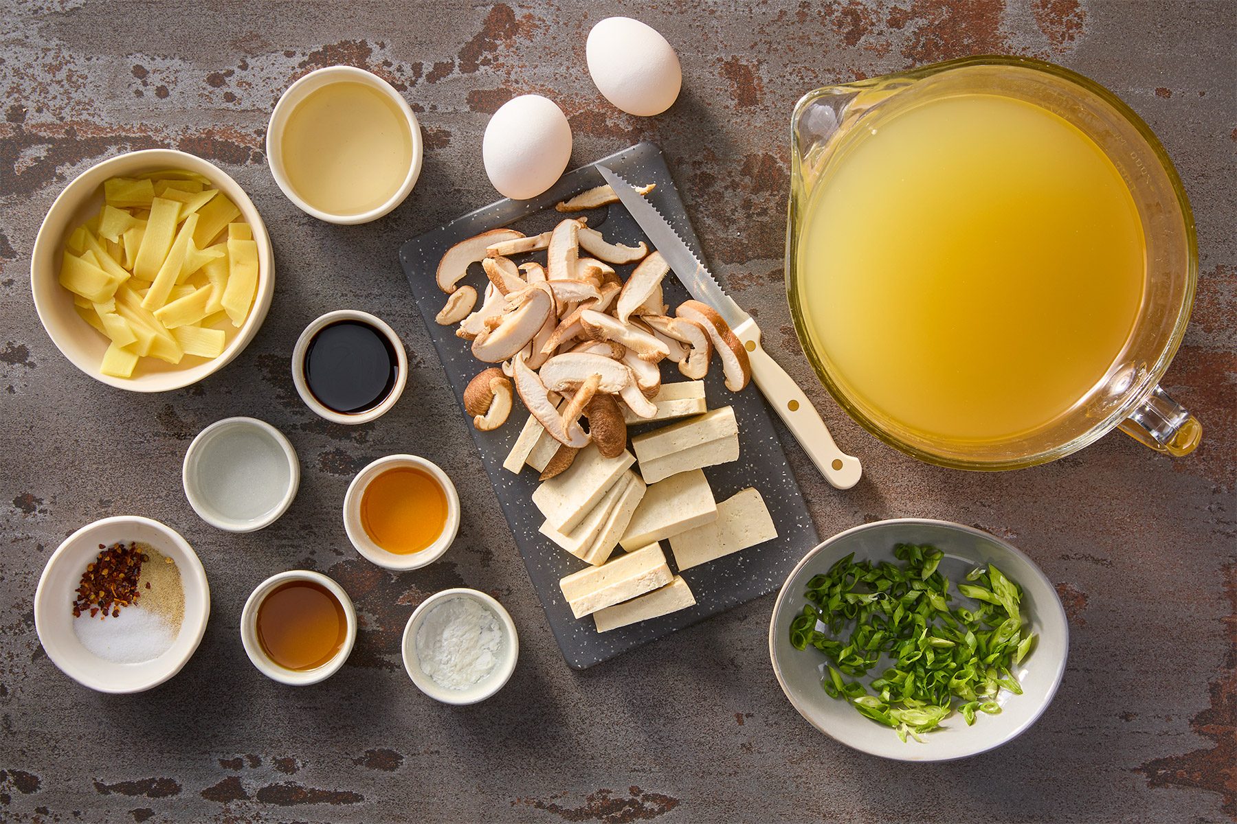 Overhead shot of all ingredients; brown texture background;