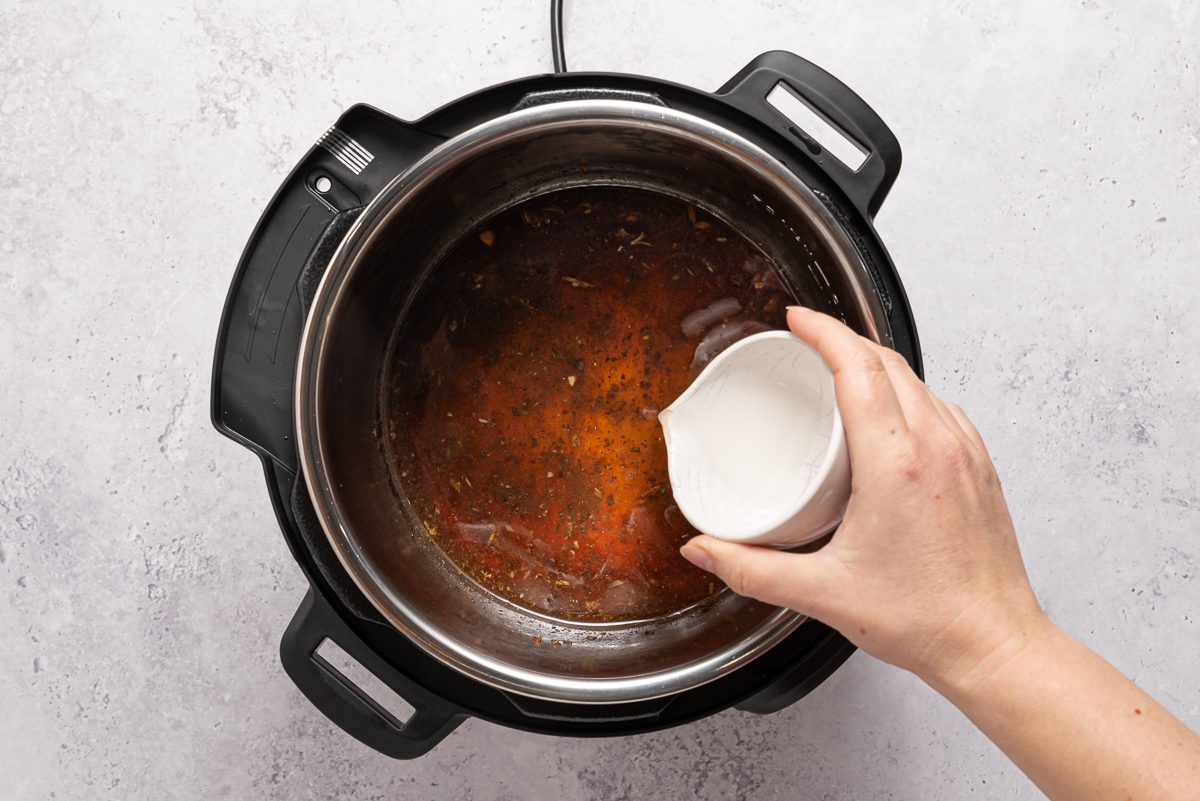 Corn Starch Mix Poured Inside Sauce In Instant Pot
