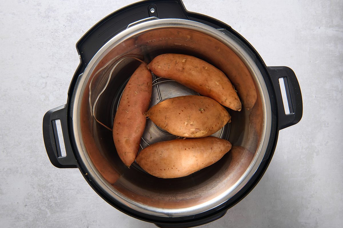 Sweet potatoes placed on top of trivet in the Instant Pot