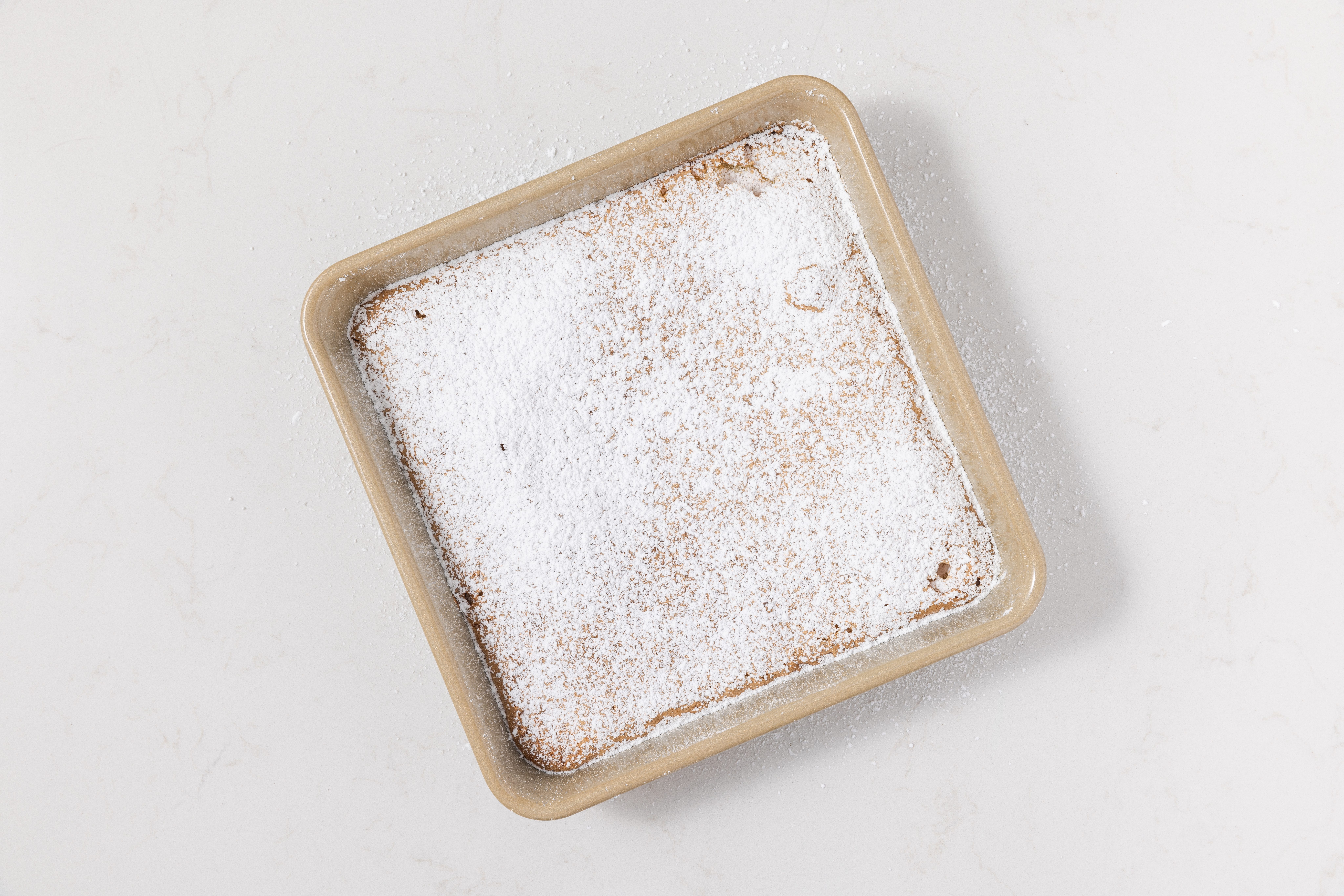 Lemon bars baked and finalized with confectioner's sugar.