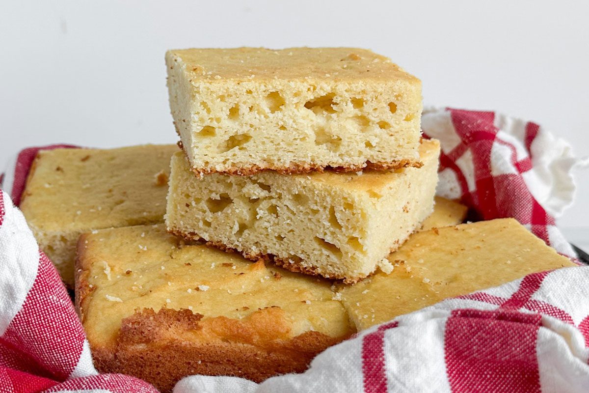Taste of Home Masa Cornbread in a napkin lined metal pan