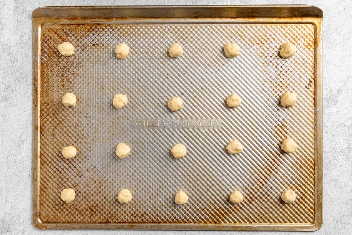 portioned raw dough on cookie sheets.