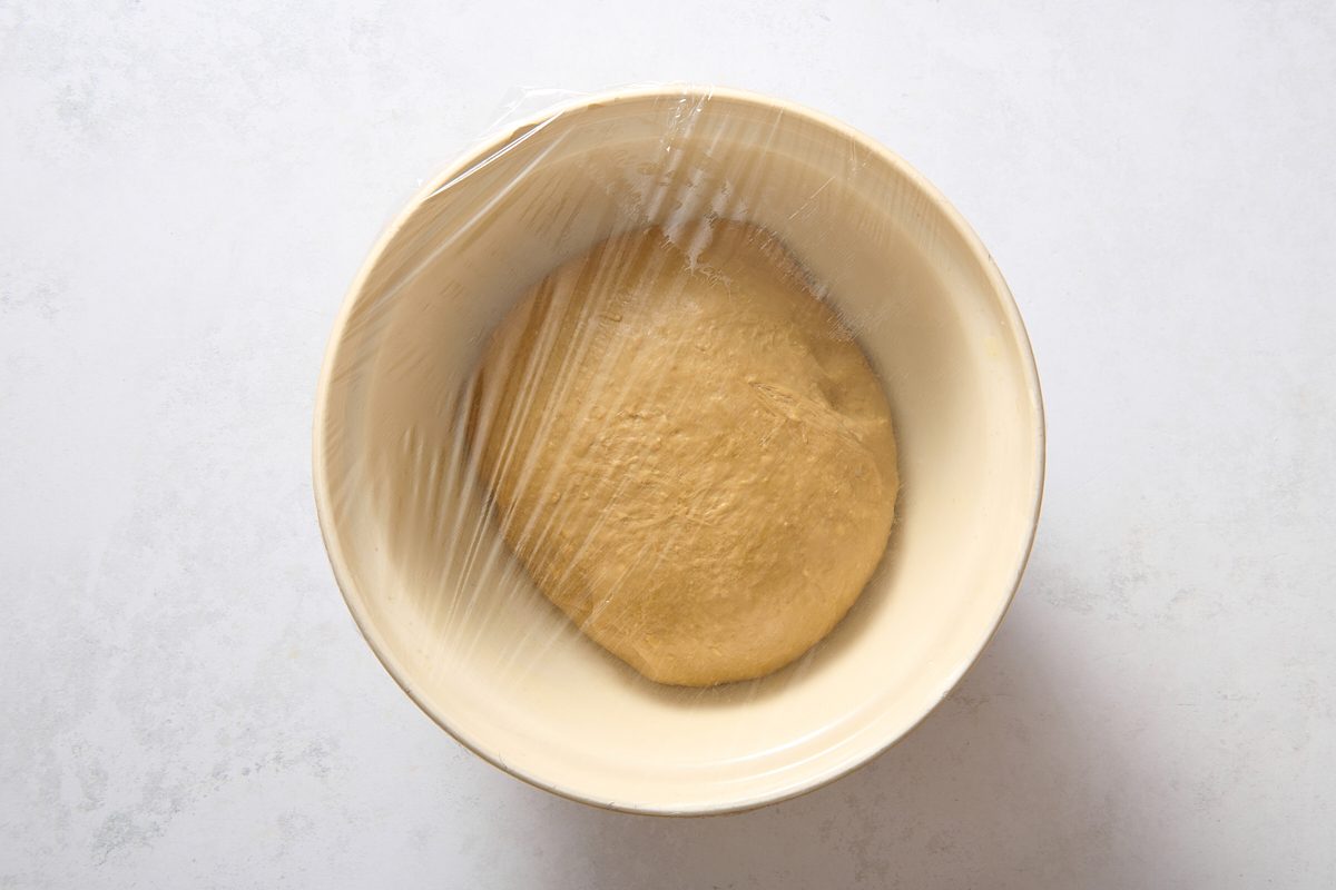 Dough in a covered greased bowl ready to be proofed