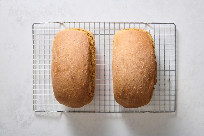 Loaves after being baked, cooling on a rack