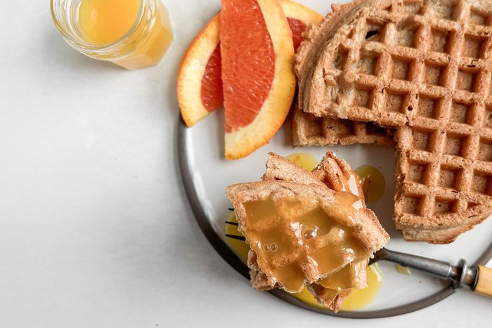 Taste of Home Orange Syrup with waffles and orange slices