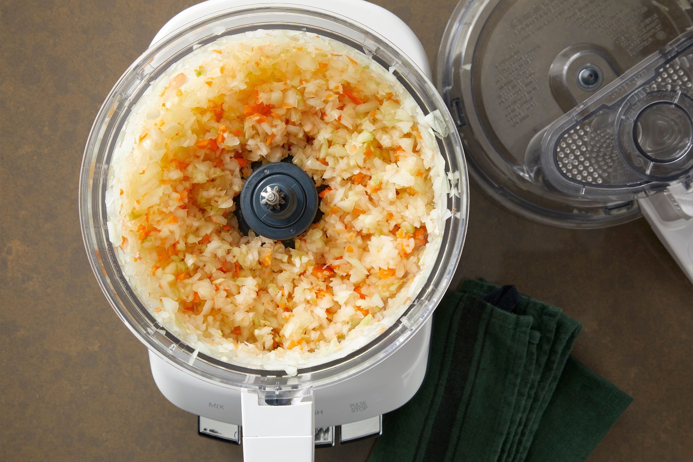 Finely chopped onions, celery, carrot and garlic in a food processor
