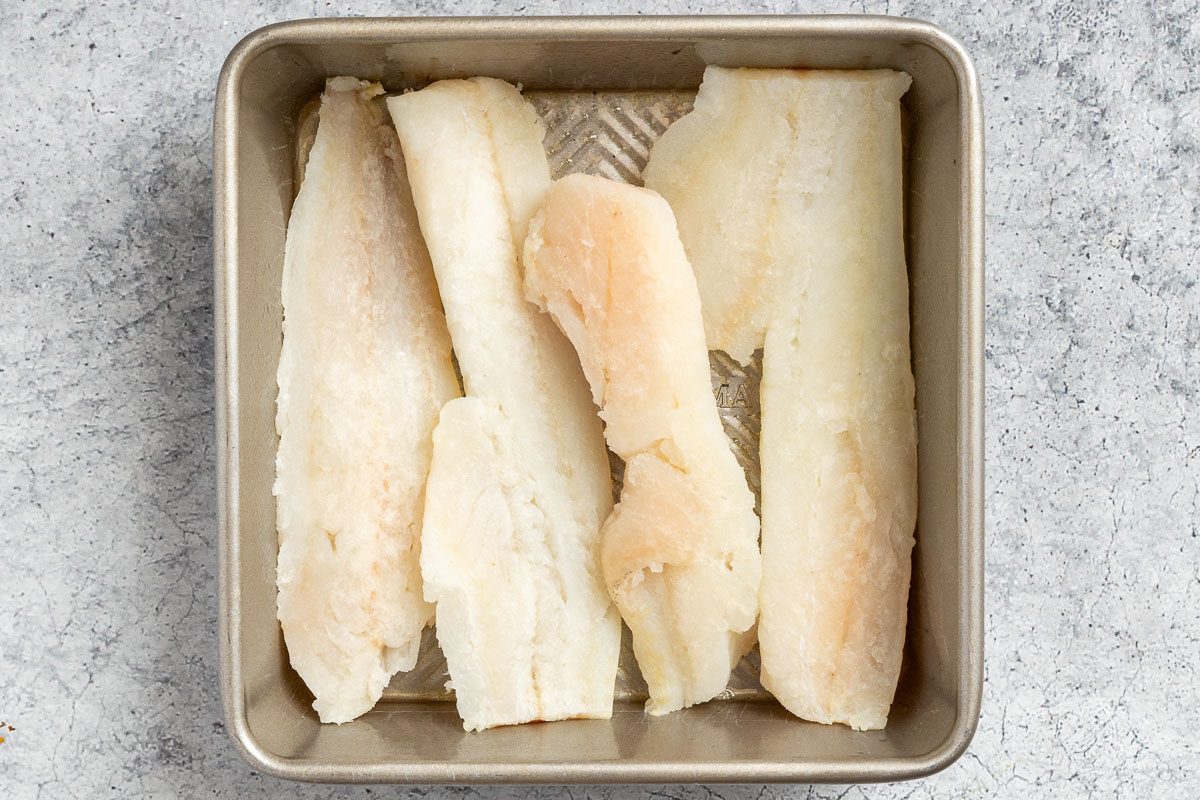 Taste of Home Parmesan Baked Cod photo of the cod filets in a baking dish.