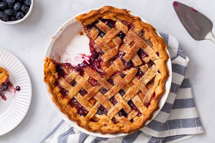 Sliced Peach and Blueberry Pie in an overhead shot for Taste of Home