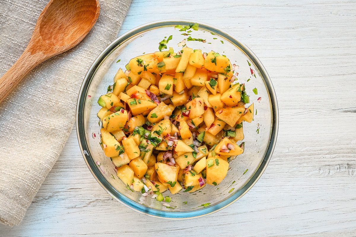 Fresh peach salsa in a bowl, by Taste of Home.