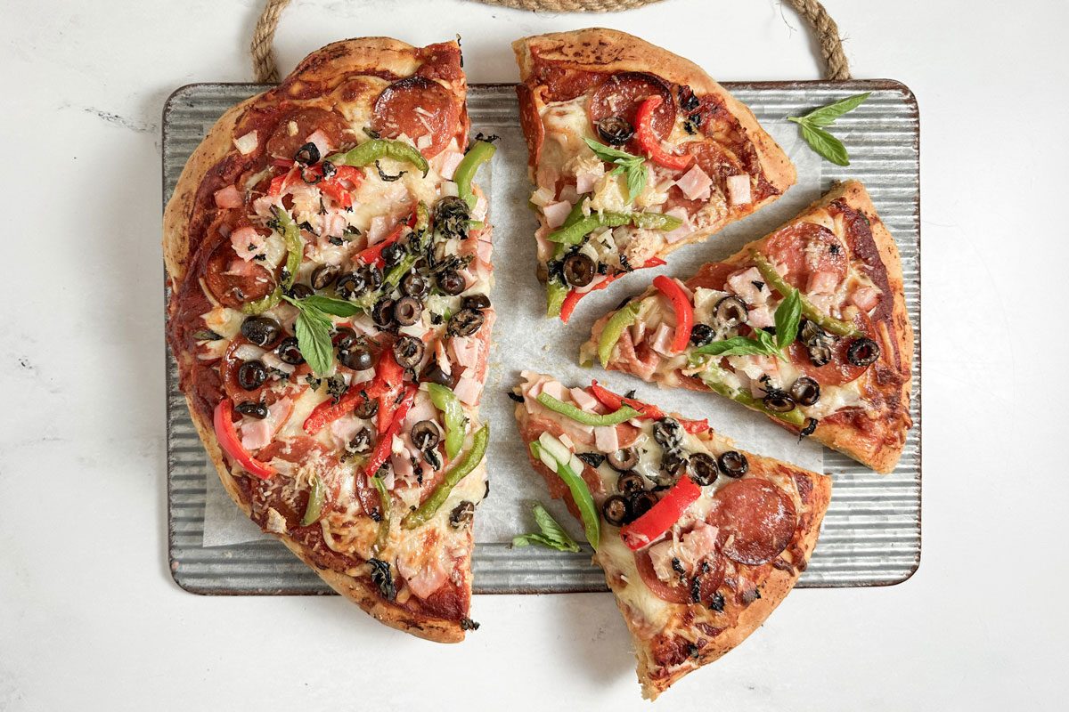 Taste of Home Pizza Supreme on a ribbed metal tray