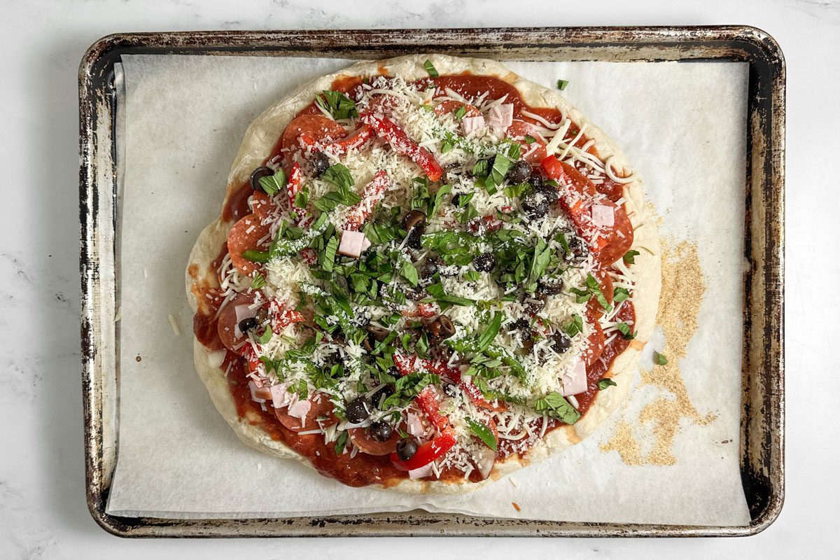 Unbaked Taste of Home Pizza Supreme on a baking sheet
