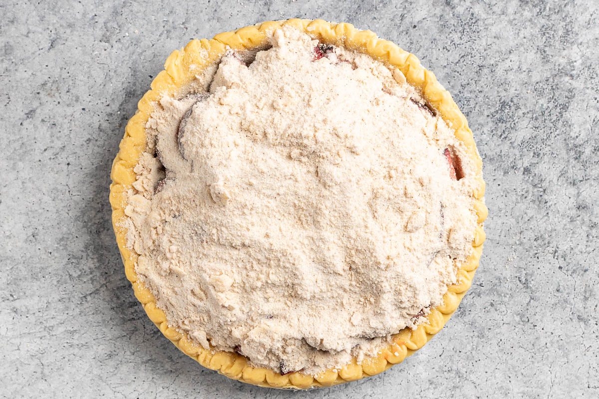 Taste of Home Plum Pie photo of the crumble sprinkled on top of the pie.