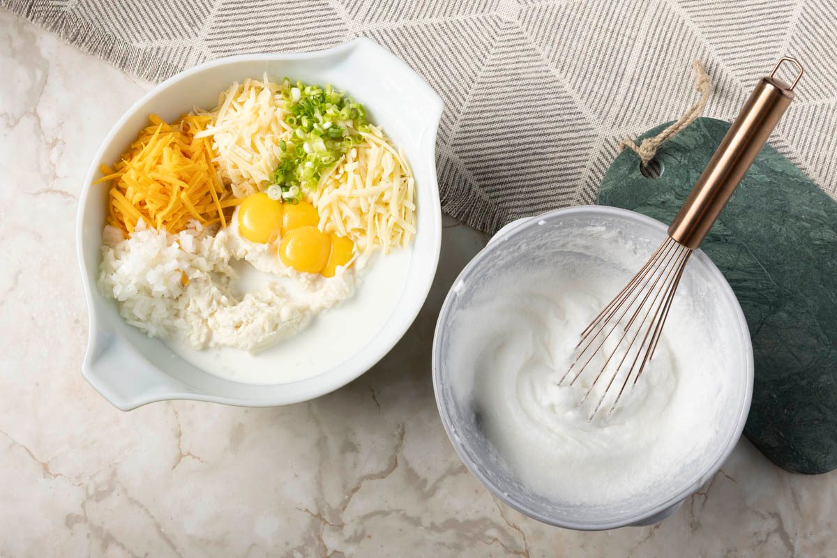 large bowl, combine the mashed potatoes, milk, cheeses, green onions, onions for Potato Souffle