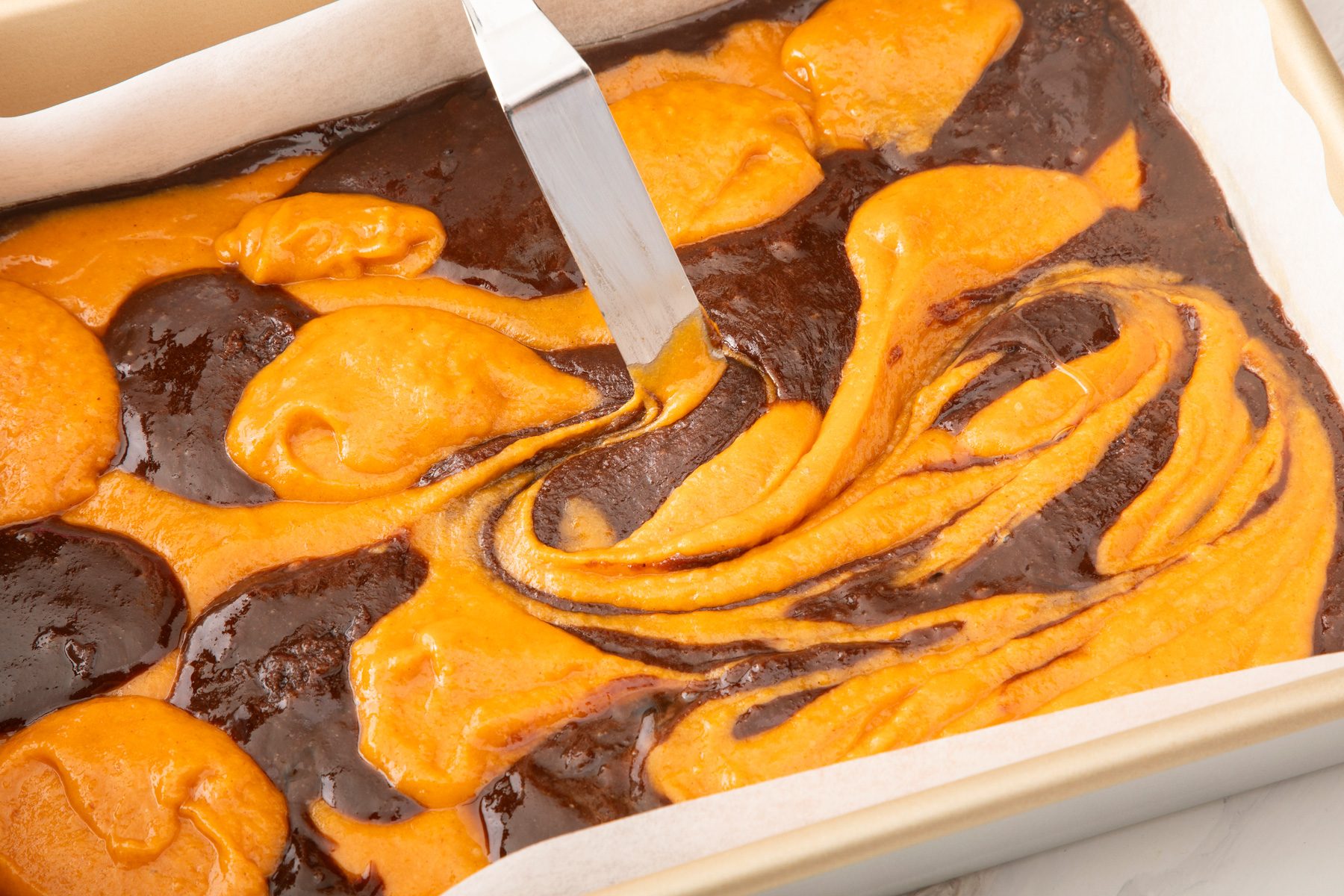 Evenly spread the batter in the baking tray