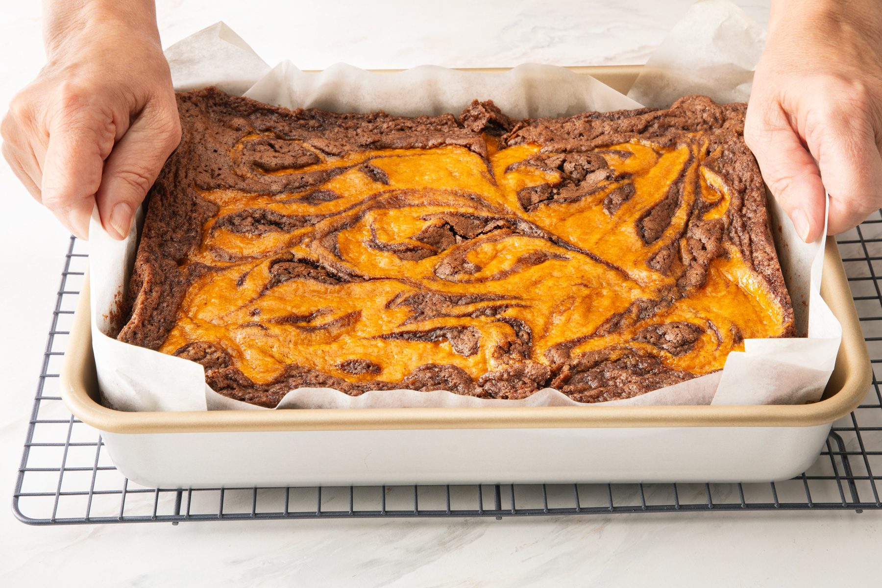 Pumpkin brownie batter in tray 