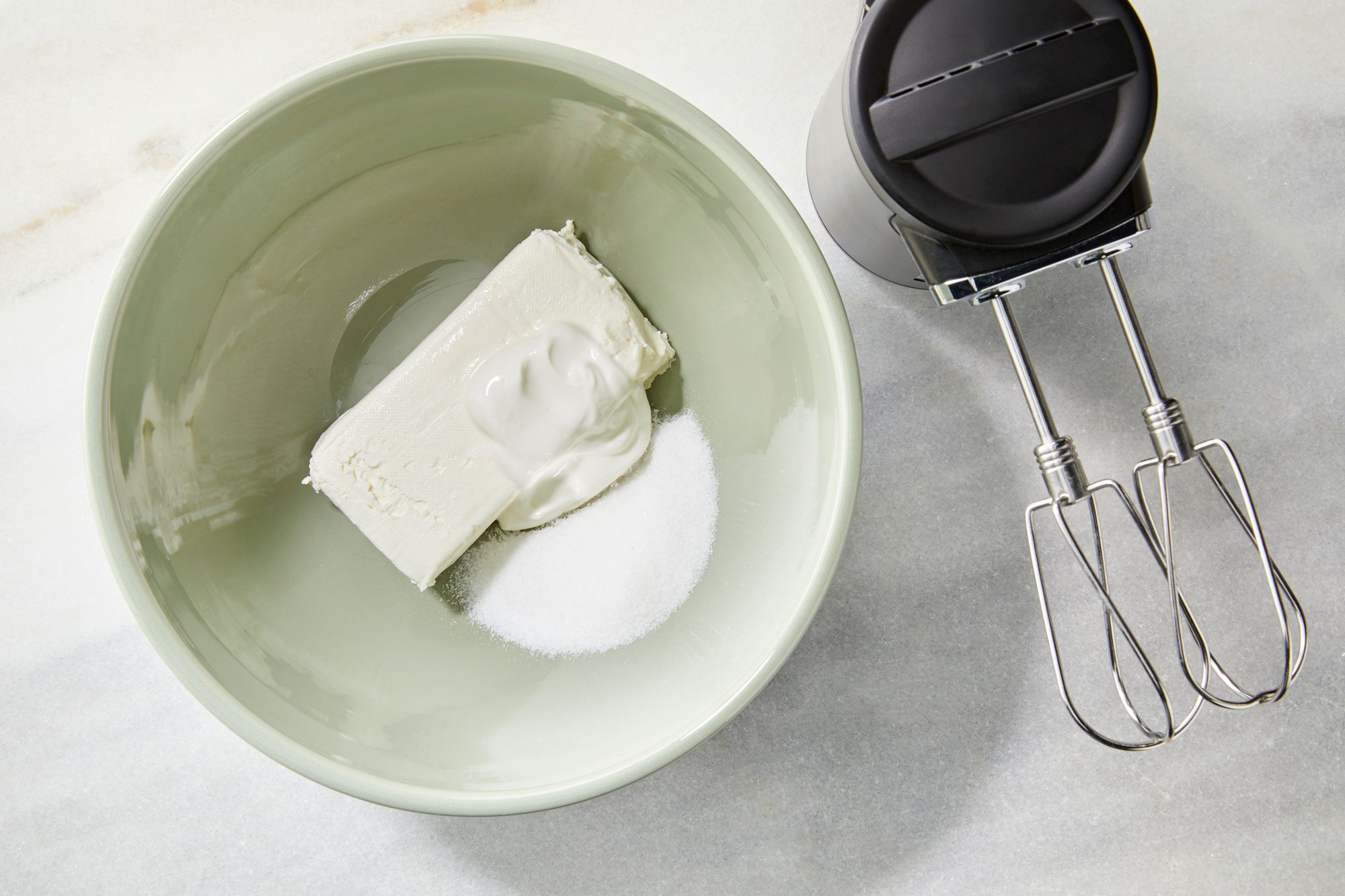 Cream cheese filling ingredients in bowl cream cheese sugar sour cream